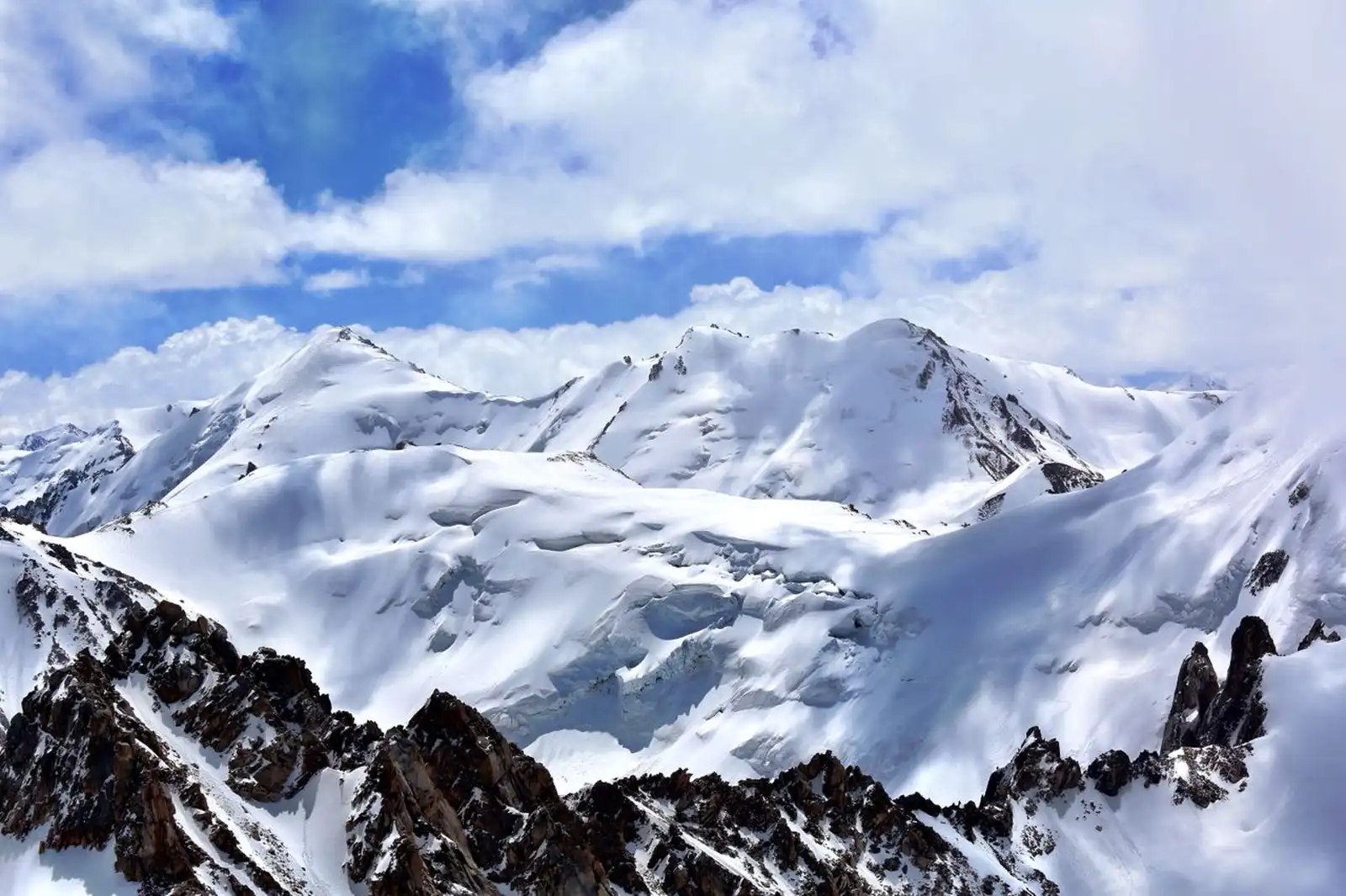 Glaciated snow-capped peaks of the Tien Shan mountains near Almaty seen from above